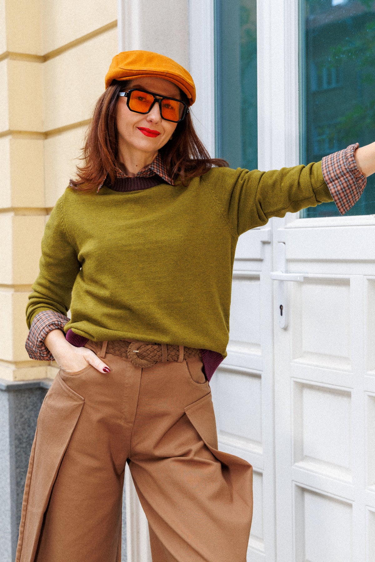 Olive-green sweater with contrasting burgundy accents