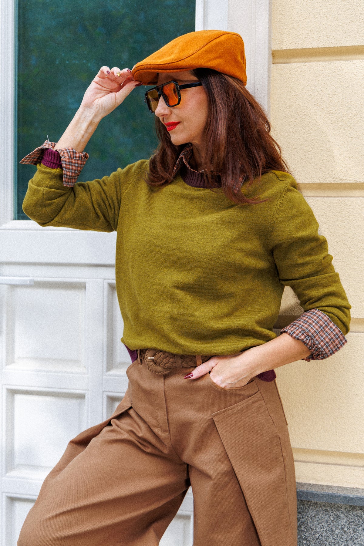 Olive-green sweater with contrasting burgundy accents