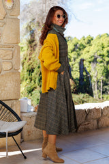 The dress in a wonderful plaid!